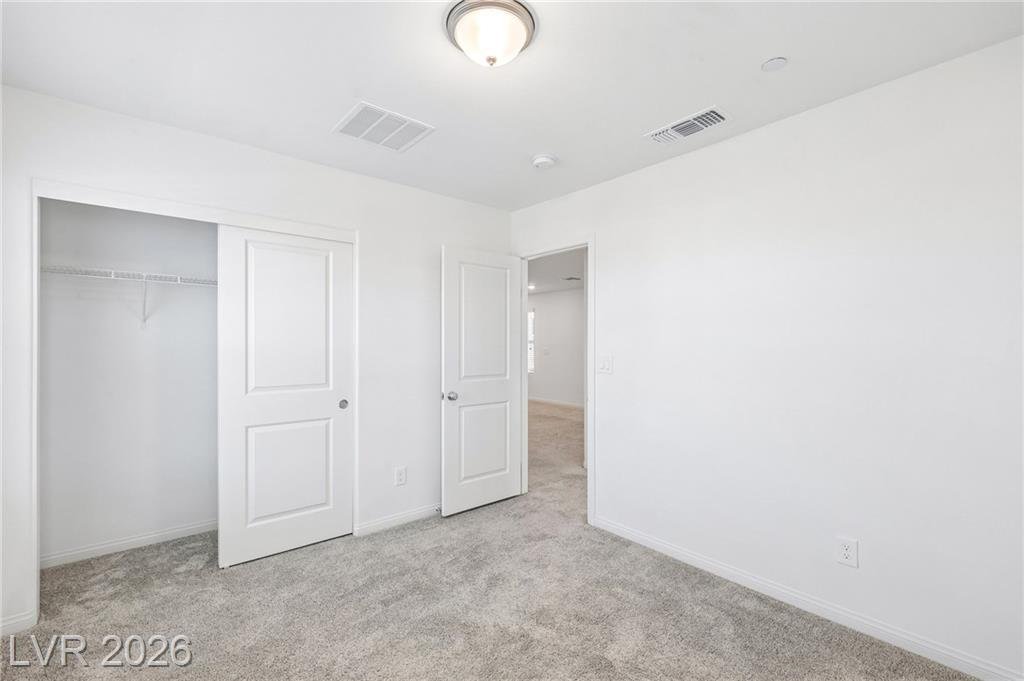 Third bedroom sliding closet and doorway