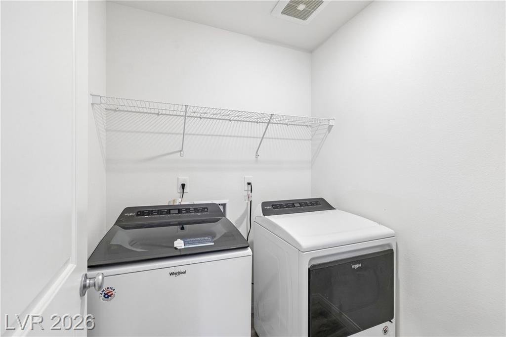 Upstairs laundry room with the included washer and dryer