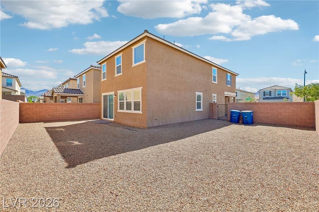 Wide corner-lot backyard with block wall fencing at 3212 Segesta Avenue