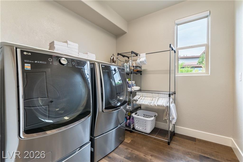 Laundry room with front-load washer and dryer and a window