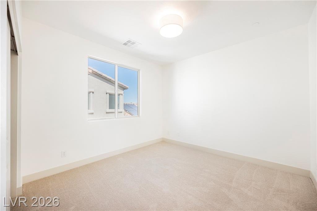 Upstairs bedroom with carpet and natural light