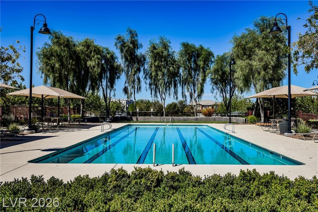 Inspirada community lap pool with shade umbrellas