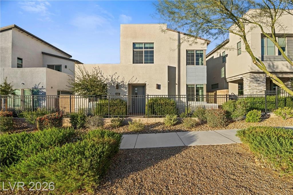 Daytime front elevation of 2702 Marchetti Place with the gated front walk
