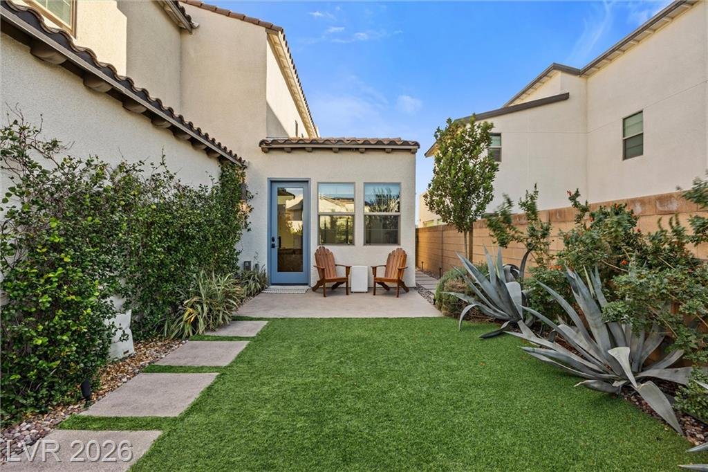 Turf side yard with agave and paver steps at 2702 Marchetti Place
