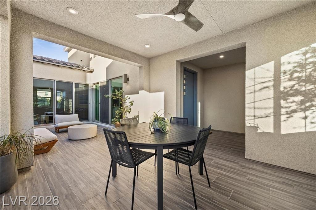 Covered patio at 2702 Marchetti Place with outdoor dining looking toward the courtyard