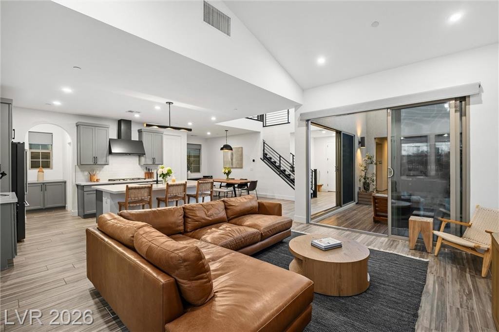 Great room sectional facing the open sliding glass wall to the patio