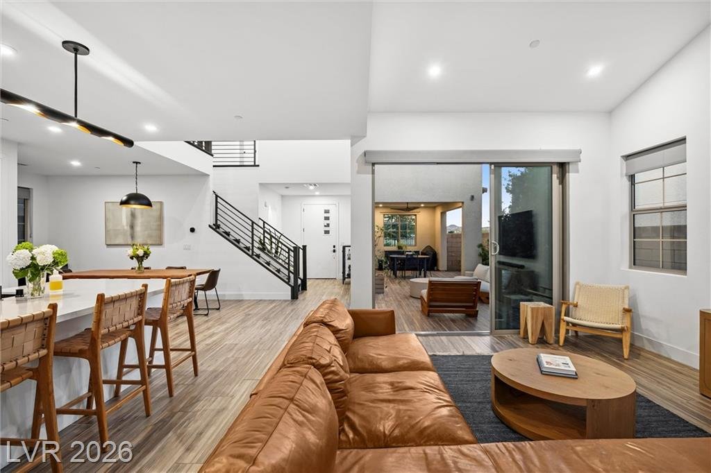 Great room and breakfast bar with the modern staircase in view