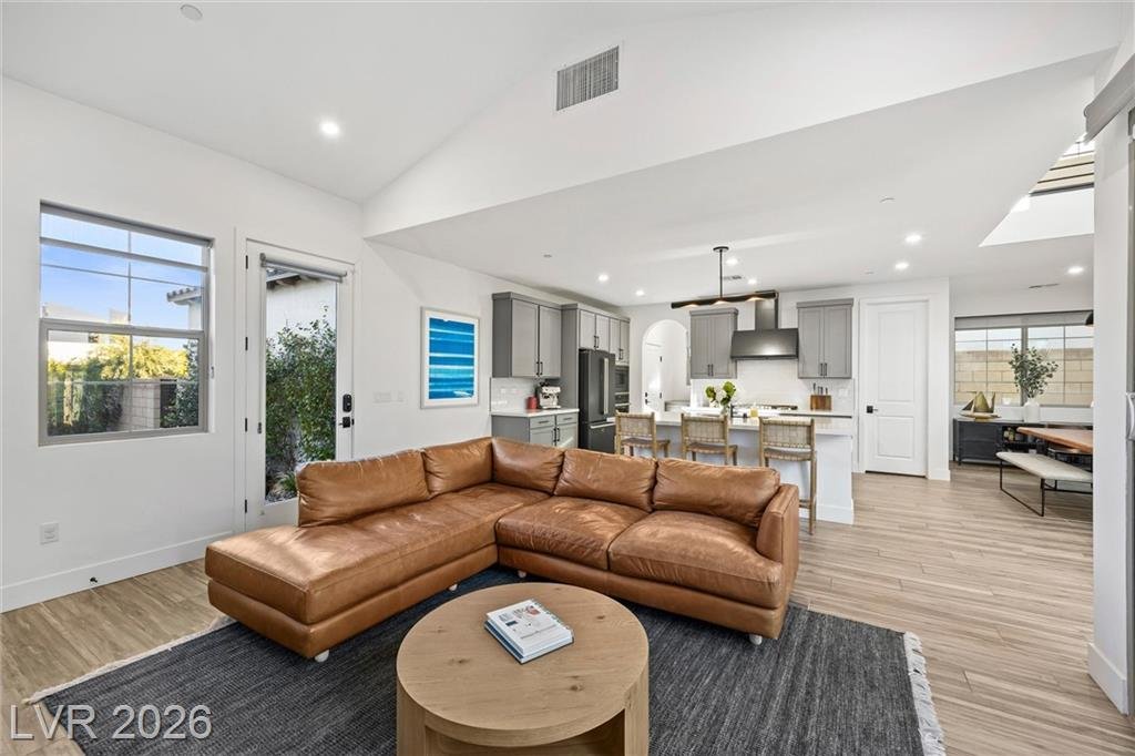 Leather sectional in the great room at 2702 Marchetti Place under a vaulted ceiling
