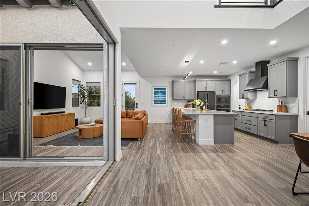 Open main floor from the slider across the great room to the kitchen