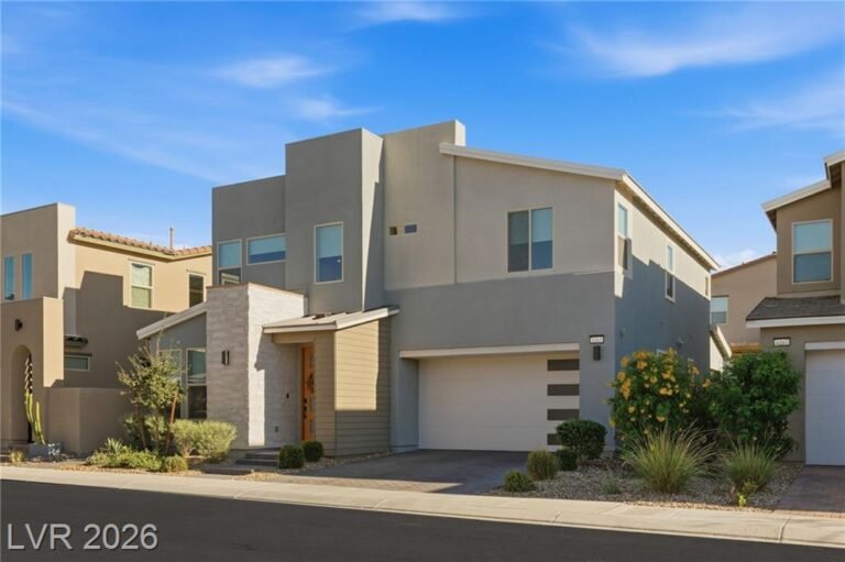 Modern two-story front with stacked stone accent and desert landscaping at 3263 Fountaintree Avenue