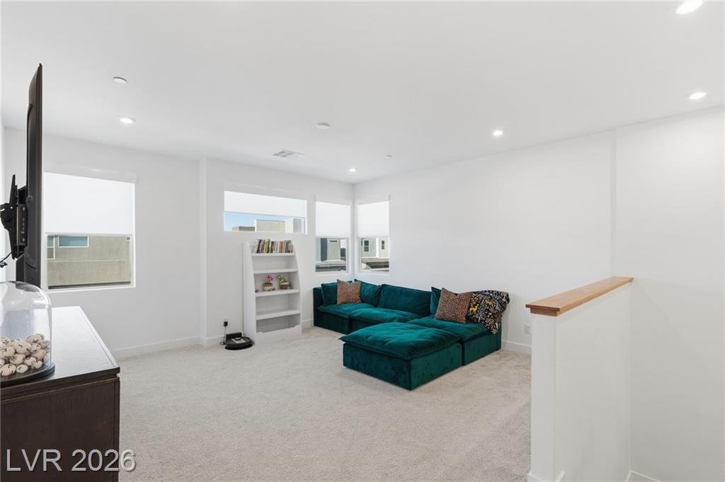 Upstairs loft with open shelving and room for a sectional at 3263 Fountaintree Avenue