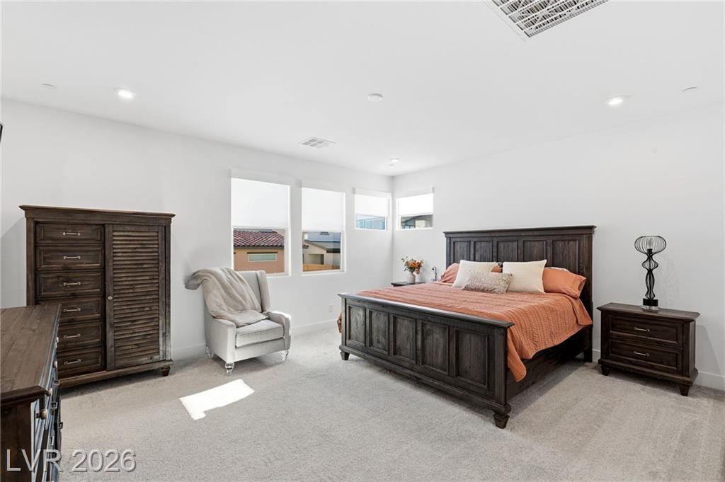 Primary bedroom with a wall of windows and plush carpet at 3263 Fountaintree Avenue