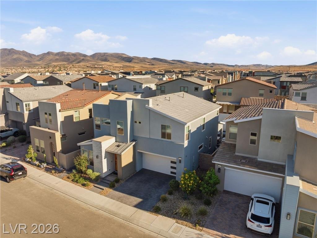 Aerial of the street with mountains in the distance in Inspirada