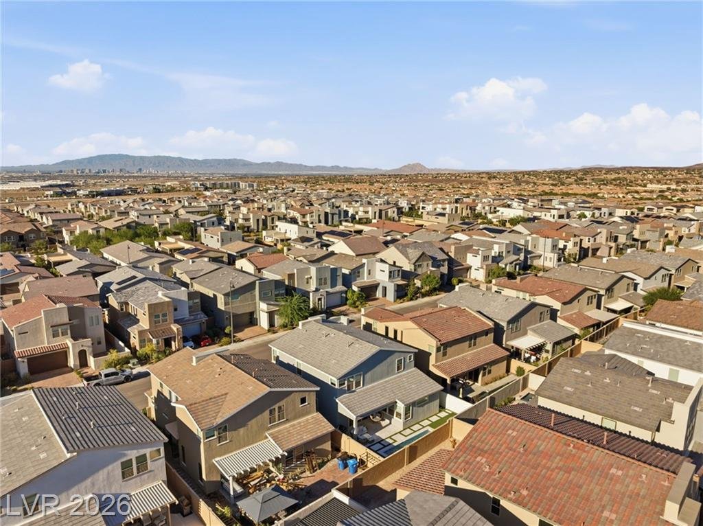 Wide aerial across the Inspirada neighborhood toward the valley