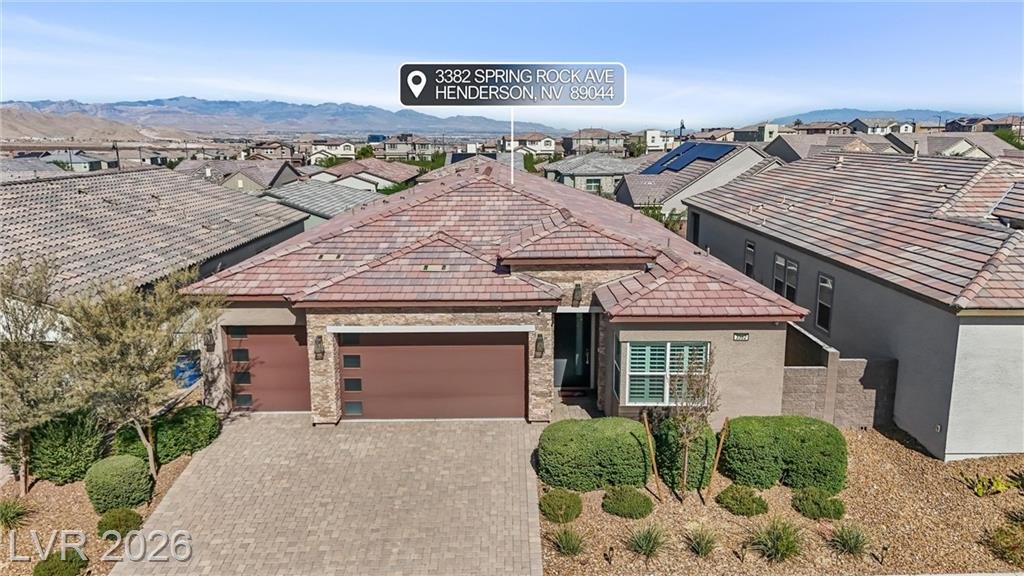 Aerial view of 3382 Spring Rock Avenue with the mountains to the west