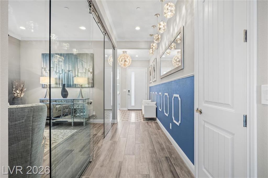 Entry hall at 3382 Spring Rock Avenue with the glass-walled office on the left