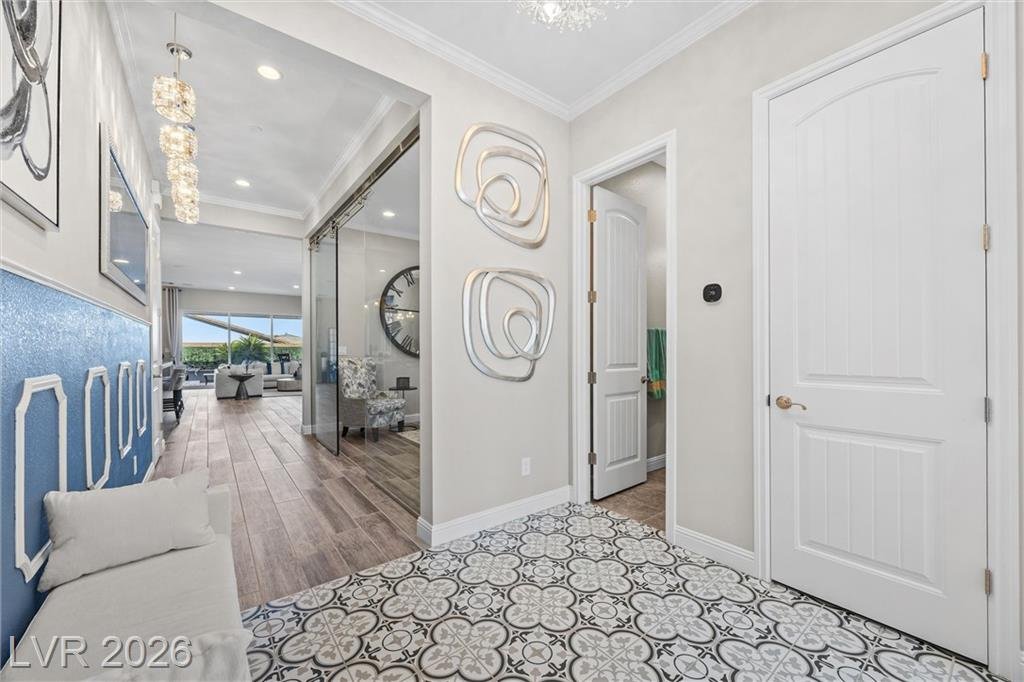 Foyer at 3382 Spring Rock Avenue with patterned tile and a blue wainscot accent wall