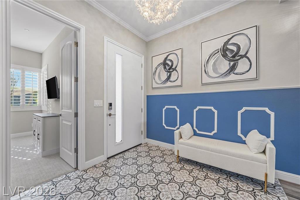 Front door, patterned floor tile and a bench under framed artwork