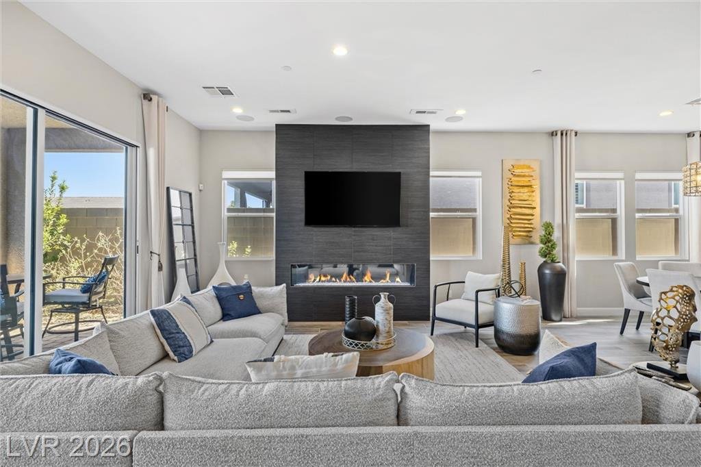 Great room at 3382 Spring Rock Avenue with a linear gas fireplace