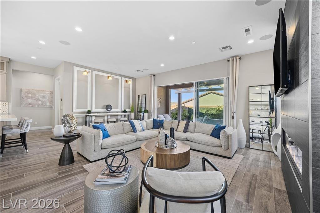Sectional and coffee table beside the fireplace wall