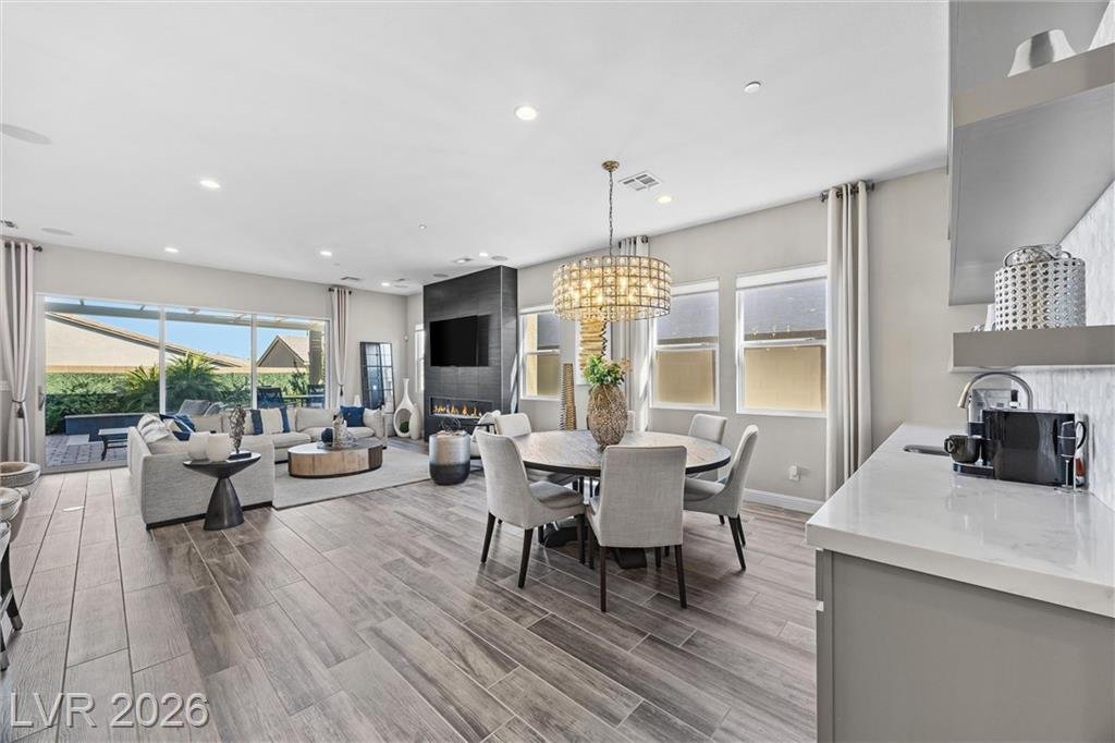 Dining area flowing into the great room and backyard view