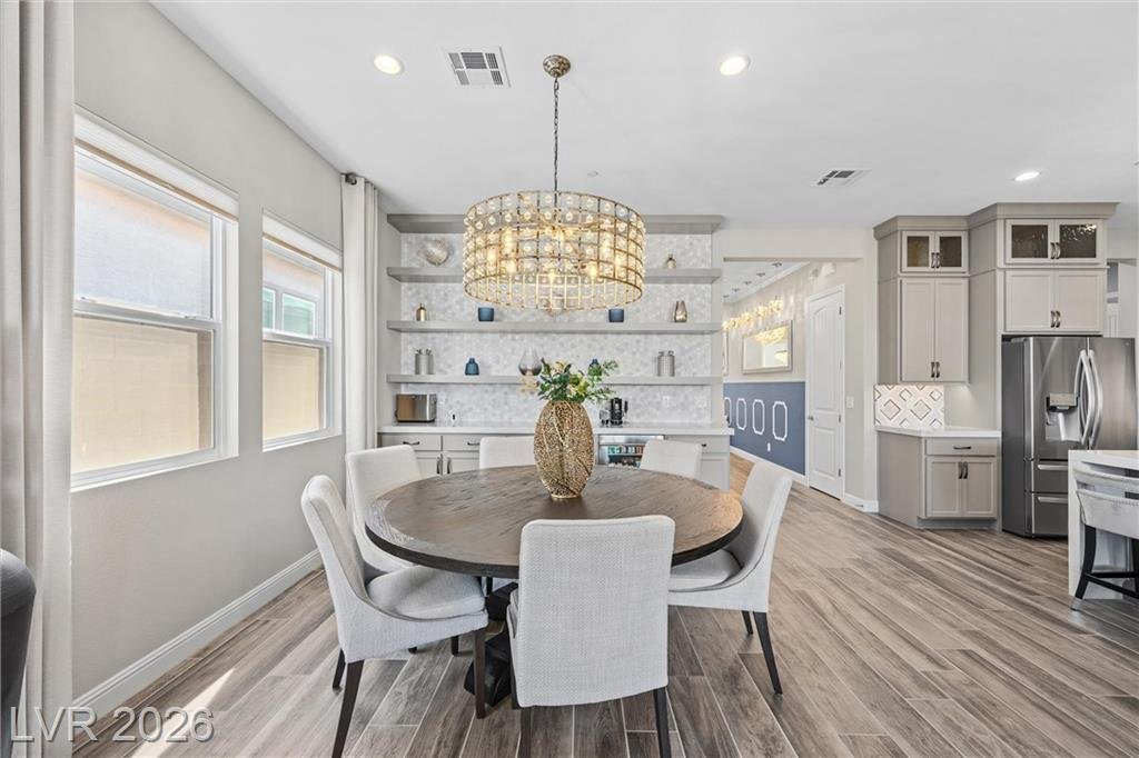 Dining area with built-in shelving and a beverage counter
