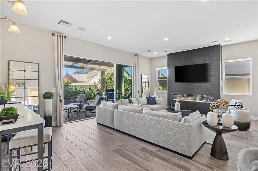 Great room at 3382 Spring Rock Avenue opening to the covered patio
