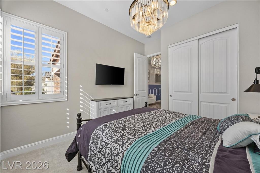 Second bedroom with a closet and its own attached bath