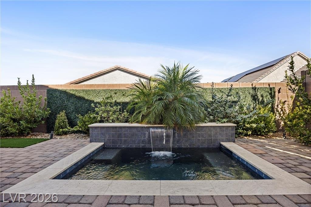Hot/cold spa with a waterfall feature at 3382 Spring Rock Avenue