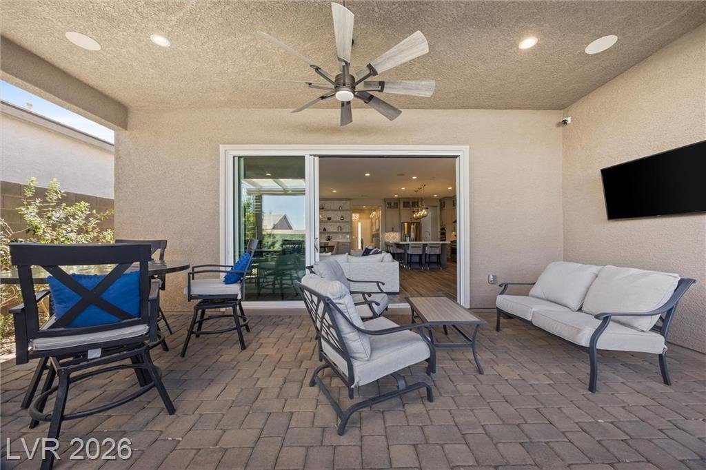 Covered patio seating with an outdoor TV