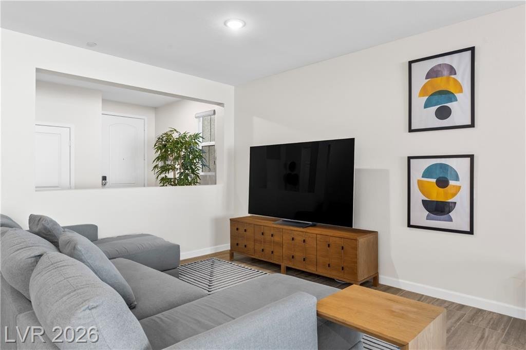 Living room media wall with a wood console and built-in niche