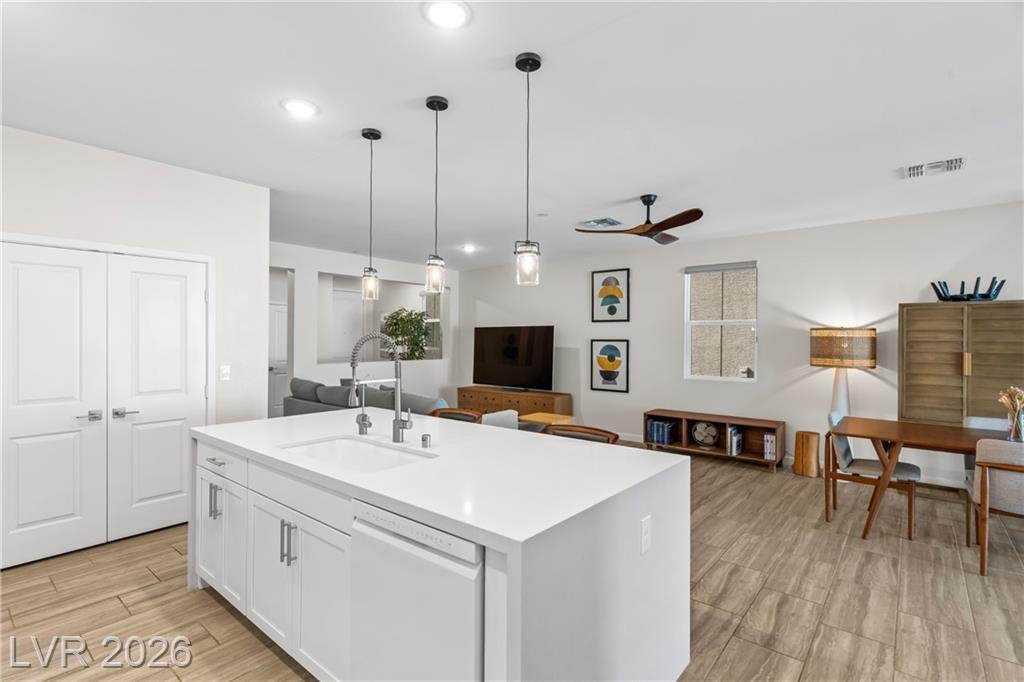 Kitchen island sink looking into the great room