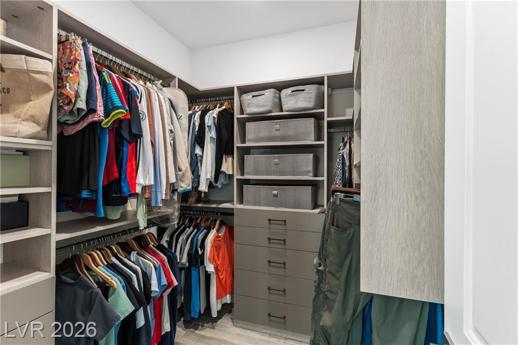 His-and-hers California Closets with drawers and hanging space