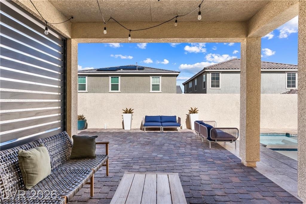 Covered patio at 3500 Brezine Avenue opening to the pool and spa