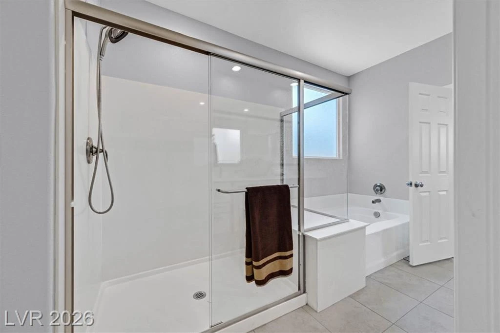 Primary Bathroom - 3193 Brescia Bank Ave Inspirada 3193 Brescia Bank Ave Henderson NV - Primary Bathroom with Walk-In Shower & Soaking Tub | Inspirada Home for Sale