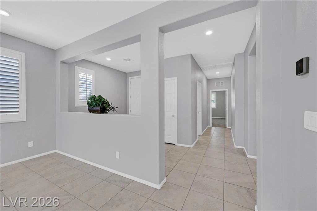 Main Hallway with Decorative Niche - 3193 Brescia Bank Ave Inspirada 3193 Brescia Bank Ave Henderson NV - Modern Hallway with Pass-Through Niche | Inspirada Home for Sale