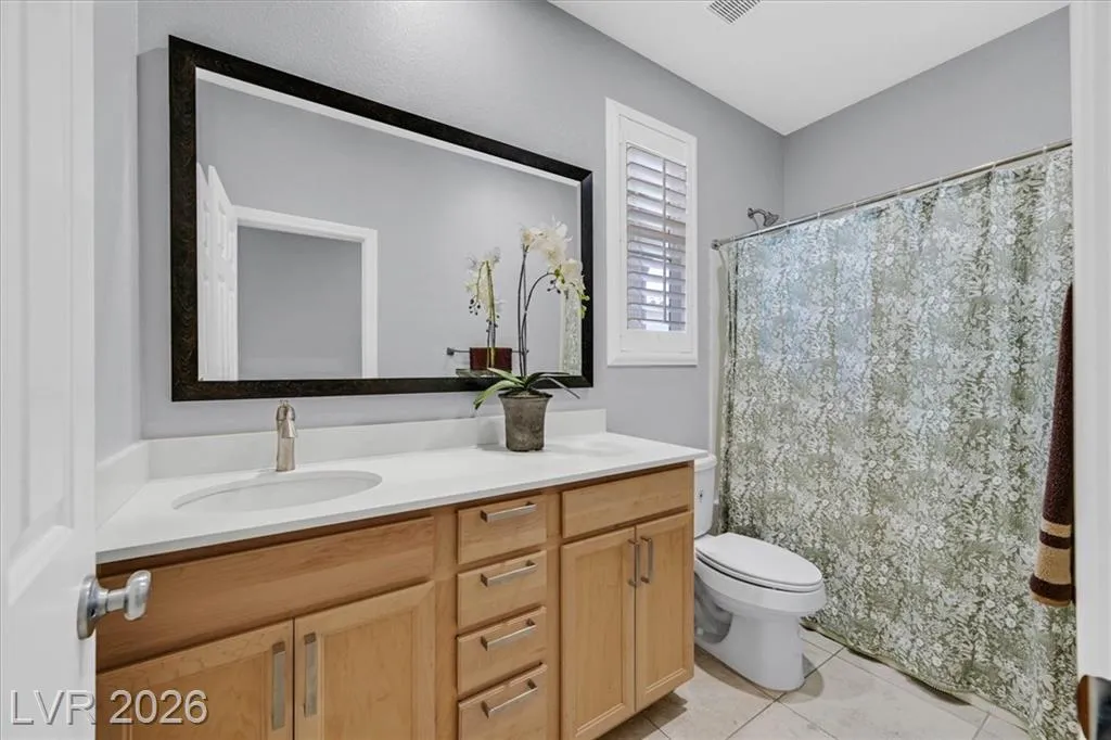 Master Bathroom - 3193 Brescia Bank Ave Inspirada 3193 Brescia Bank Ave Henderson NV - Master Bathroom with Wood Vanity and Black Mirror | Inspirada Home for Sale
