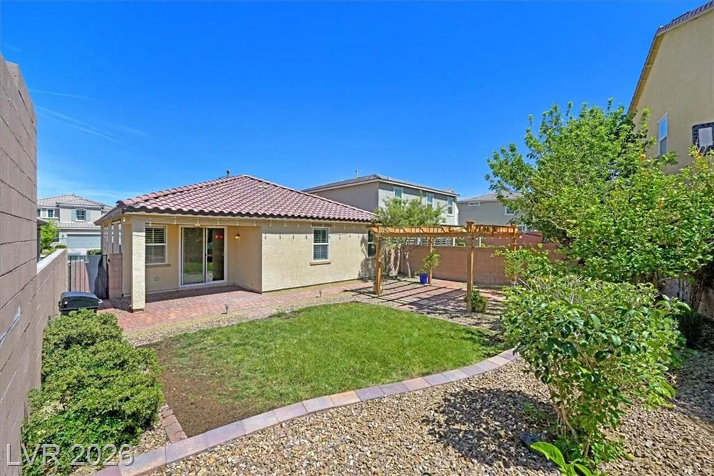 Backyard Patio Area - 3193 Brescia Bank Ave Inspirada 3193 Brescia Bank Ave Henderson NV - Backyard with Patio, Lawn & Wood Pergola | Inspirada Home for Sale