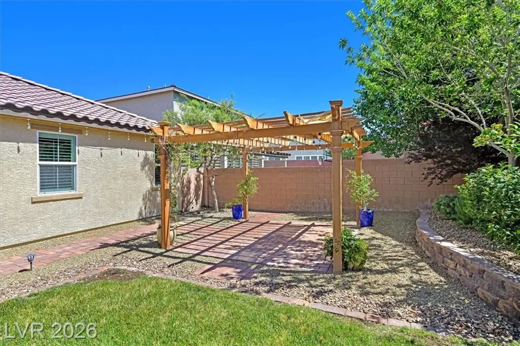 Backyard Patio - 3193 Brescia Bank Ave Inspirada 3193 Brescia Bank Ave Henderson NV - Backyard Patio with Wood Pergola and Brick Pavers | Inspirada Home for Sale