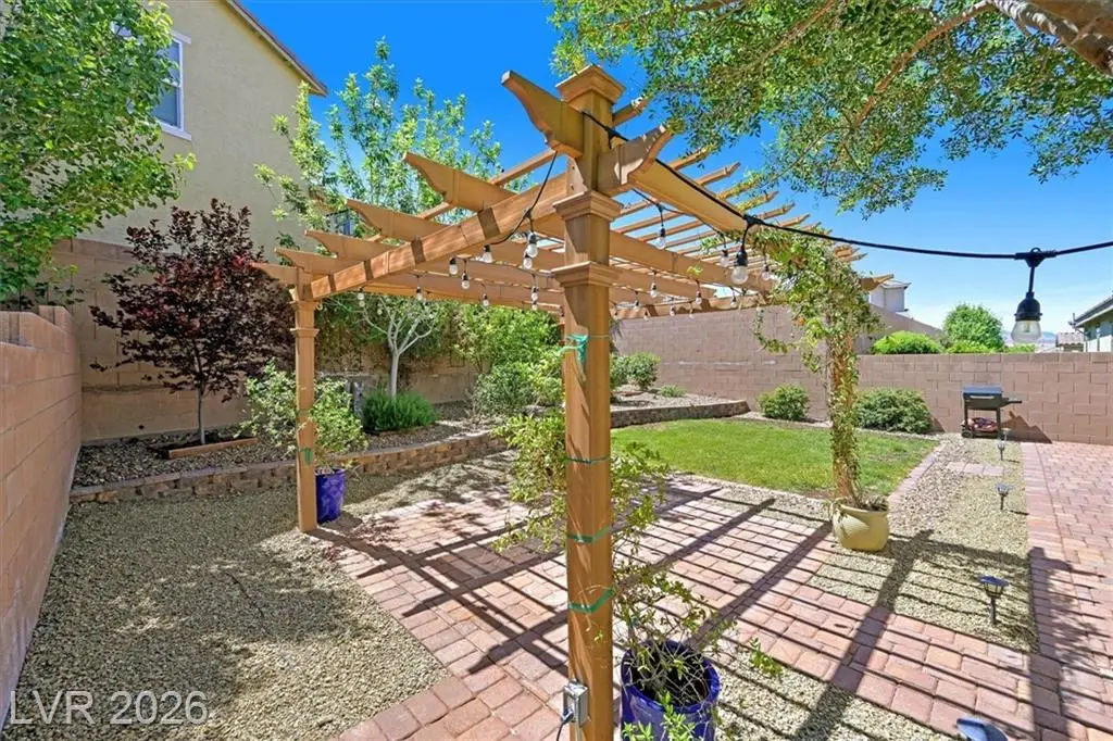 Backyard Pergola - 3193 Brescia Bank Ave Inspirada 3193 Brescia Bank Ave Henderson NV - Backyard Pergola with Brick Patio and Landscaping | Inspirada Home for Sale