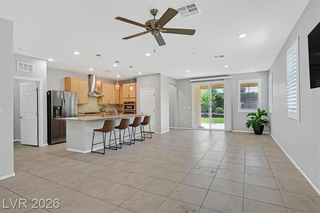 Kitchen and Family Room - 3193 Brescia Bank Ave Inspirada 3193 Brescia Bank Ave Henderson NV - Open Concept Kitchen and Family Room with Island Seating | Inspirada Home for Sale