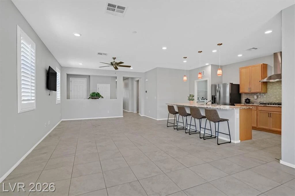Open Concept Kitchen with Island - 3193 Brescia Bank Ave Inspirada 3193 Brescia Bank Ave Henderson NV - Open Concept Kitchen and Family Room | Inspirada Home for Sale