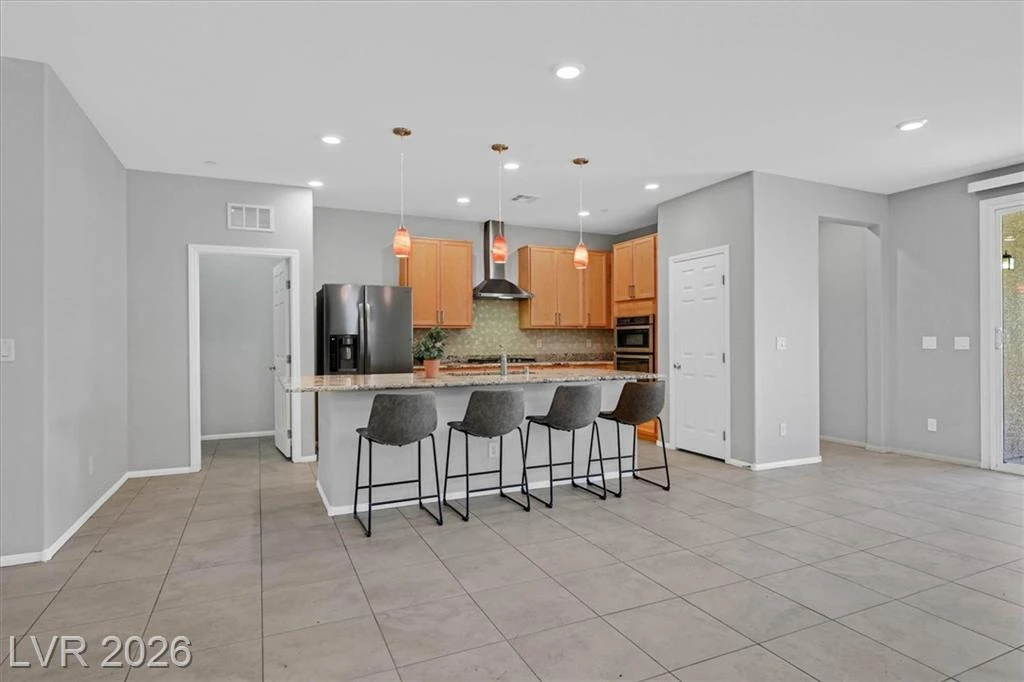 Kitchen with Island - 3193 Brescia Bank Ave Inspirada 3193 Brescia Bank Ave Henderson NV - Open Concept Kitchen with Island and Breakfast Bar | Inspirada Home for Sale